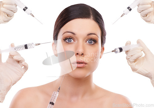 Image of Woman, portrait and syringe for plastic surgery in shock in studio, injection and chemical by white background. Girl patient, surgeon and wow for needle with change, transformation or beauty results