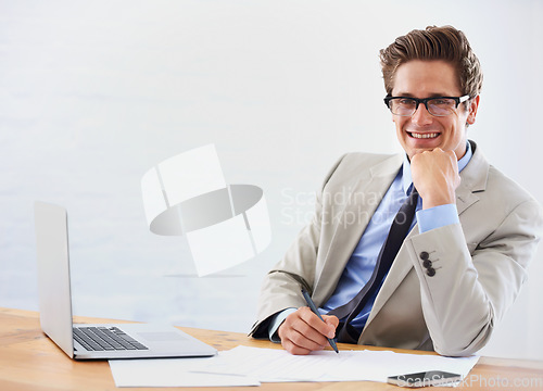 Image of Business man, computer and paperwork in office portrait for financial planning, taxes or accounting management. Accountant or auditor in glasses with documents, writing report and laptop for research