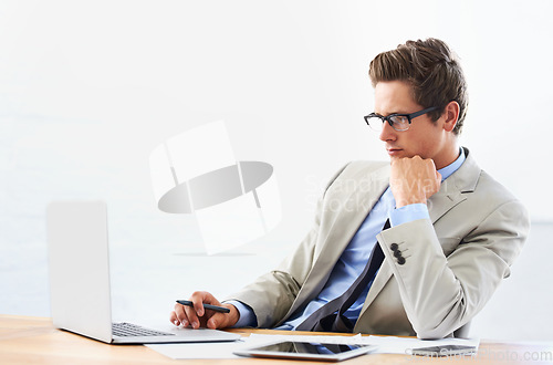 Image of Business man, computer and thinking of stock market research, trading solution and choice or decision. Professional person or trader reading in glasses and vision for financial planning on his laptop