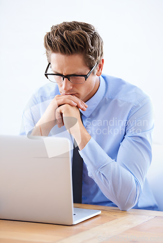 Image of Business man, laptop and thinking of research in stock market, trading solution and choice or decision. Professional person or trader in reading glasses, vision and financial planning on his computer
