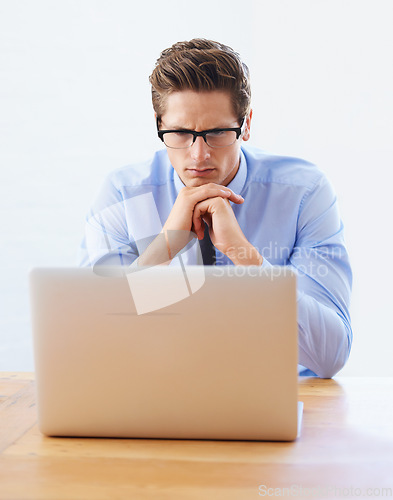 Image of Business man, confused and thinking on computer for research, online planning and investment decision. Professional analyst or trader in reading glasses, problem solving or trading solution on laptop