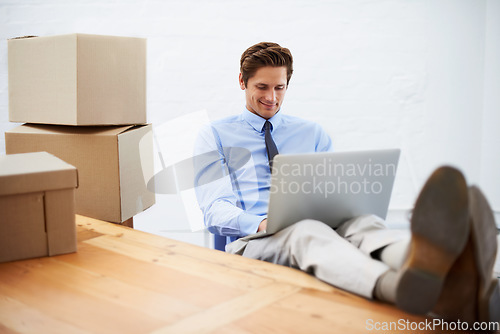 Image of Businessman, shipping and smiling on laptop, entrepreneur and online logistics for courier. Happy male person, professional and delivery for company distribution, relax and package or internet