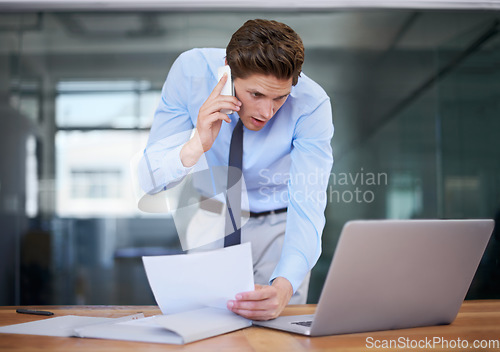 Image of Business man, phone call and reading computer, documents and paperwork for planning, accounting and financial advice. Professional worker talking on mobile and laptop information or taxes management