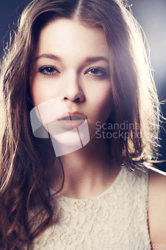 Image of Makeup, portrait of young woman in a studio with beauty, cosmetic or natural face routine. Model, cosmetology and beautiful female person from Canada with spotlight isolated by dark black background.