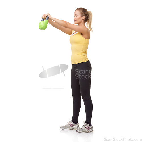 Image of Exercise, workout and studio woman with kettlebell swing for muscle growth, strong arm strength or weightlifting. Fitness club equipment, wellness commitment and girl bodybuilding on white background