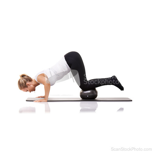 Image of Balance, exercise and woman on floor with ball for pilates, body building care and health in studio. Gym, training and girl on mat with cardio, energy and muscle workout isolated on white background.