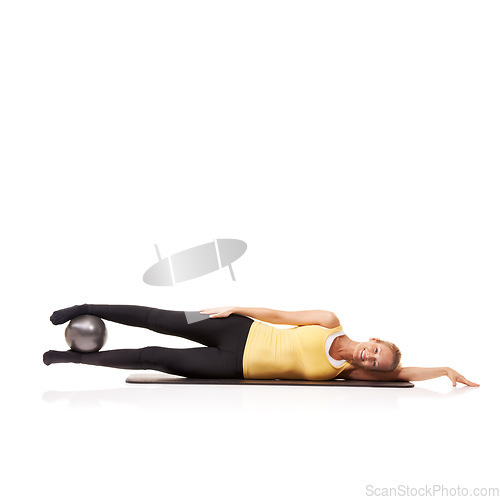 Image of Woman, portrait and ball or legs balance on side for squeeze abductor, strong thighs or white background. Female person, face and equipment in studio for health training, gym muscle or mockup space