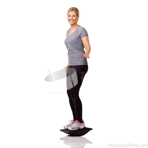 Image of Exercise, studio portrait and woman with board balance, smile and healthy body workout at gym. Fitness, stability and happy girl with wellness, pilates training and tools isolated on white background