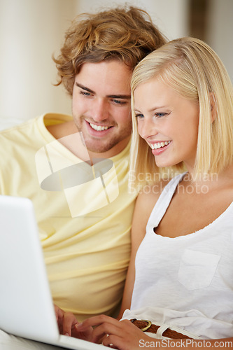 Image of Happy couple, watch on laptop and relax together for home streaming service, website and movie choice on weekend. Young man and woman reading information on computer or technology for online search