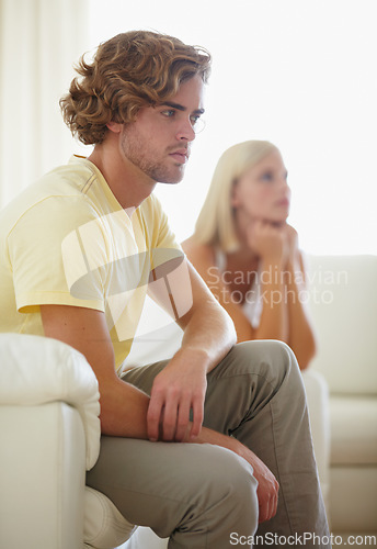 Image of Couple fight, angry and divorce stress on a sofa with argument, anxiety or cheating depression in their home. Marriage crisis, dispute and overthinking man ignore frustrated woman in a living room