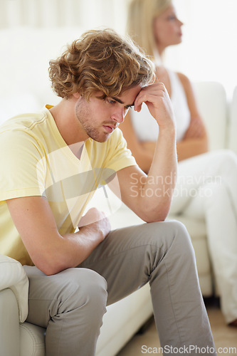 Image of Couple conflict, stress and divorce fight on a sofa with argument, anxiety or cheating depression in their home. Marriage crisis, dispute and overthinking man ignore woman narcissist in a living room