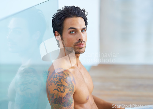 Image of Man, shirtless and portrait for relax confidence on vacation holiday, weekend rest or casual day. Male person, topless and face or tattoo ink for cool edgy look or proud muscle, chest or fit healthy