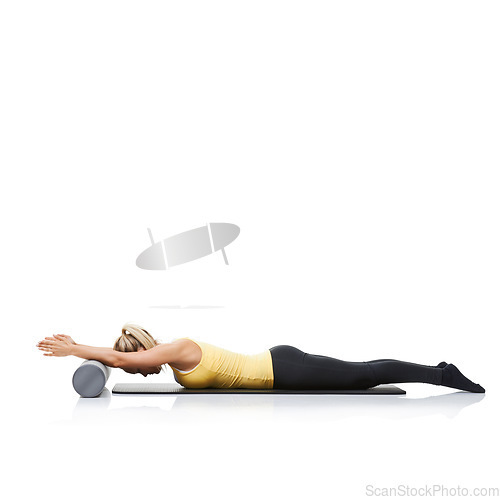 Image of Stretching, foam roller and woman in a studio for exercise, wellness or gym routine with yoga mat. Stability, balance and young female athlete from Australia with body workout by white background.