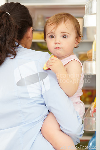 Image of Portrait, woman and fruit of toddler in kitchen, open fridge and food for hunger in back view. Youth, little girl and hold snack for eating for nutrition in healthy vegan, vegetarian or diet in home