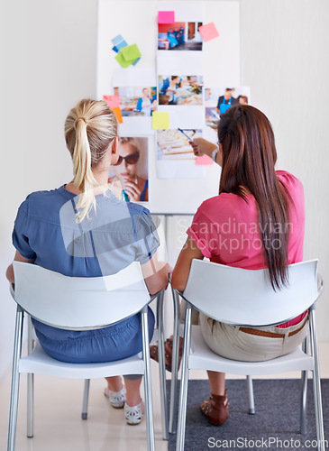 Image of Woman, pointing and whiteboard for sticky notes in office with back for discussion, planning or collaboration. Creative, writer or team for idea, moodboard or advice for magazine design by pictures