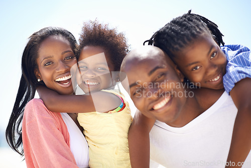 Image of Portrait, piggyback and a black family on the beach in summer together for travel, freedom or vacation. Love, smile or happy with a mother, father and children on the coast for holiday or getaway