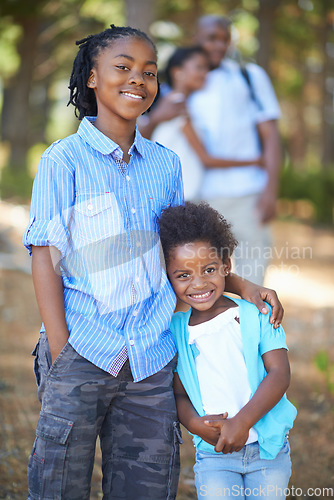 Image of Portrait, brother and sister hiking in the forest together with their parents for travel, freedom or adventure. Black family, nature or environment with a young boy and girl sibling in the woods