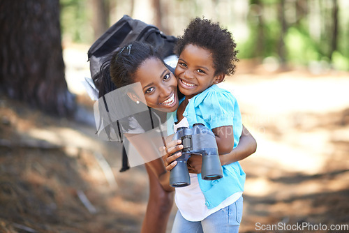 Image of Portrait, binocular or black family hiking in forest to relax, hug or bond on holiday vacation together in nature. Child, happy or mom in woods or park to travel on fun outdoor adventure with smile