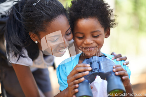 Image of Happy, binocular or black family hiking in forest to relax or bond on holiday vacation together in nature. Child, sightseeing or African mom in woods or park to travel on outdoor adventure with smile