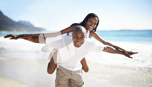 Image of Black couple, smiling and piggyback with portrait, beach and married for summer vacation. African, enjoying and happy for holiday, fun and seaside in outdoor, beautiful and day off in costal city