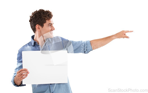 Image of Pointing, poster and young man in a studio with mockup space for marketing, promotion or advertising. Smile, happy and handsome male person from Canada with empty banner isolated by white background.