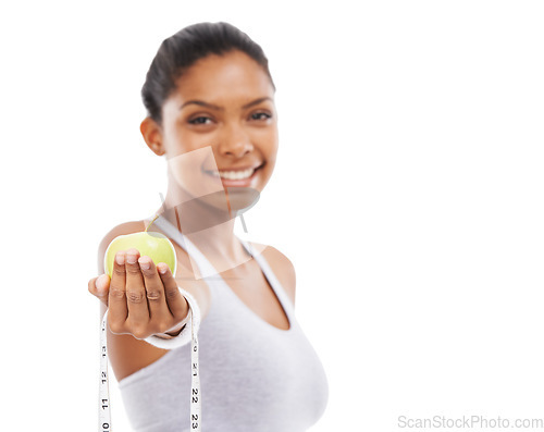 Image of Happy, woman and lose weight with apple and tape measure in white background, studio or mockup. Model, portrait and healthy food for results in fitness, wellness or diet with fruit or nutrition