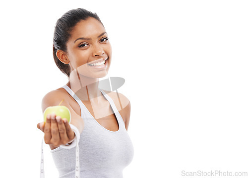 Image of Woman, portrait and lose weight with a measuring tape and apple in white background, studio or mockup. Happy, model and healthy food for results in fitness, wellness and diet with nutrition and fruit