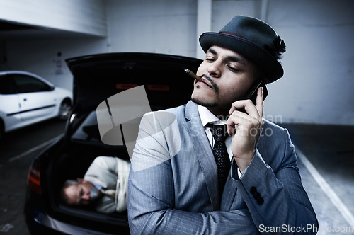 Image of Phone call, car and criminal with hostage in trunk for negotiation, kidnapping danger and crime. Mafia, gangster and business man smoking in boot for abduction, crisis and ransom in parking lot