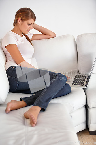 Image of Woman, laptop and relax in home on sofa to watch movies, digital news subscription and streaming multimedia. Computer, online shopping and search blog post, social network and download in living room