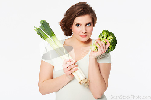 Image of Woman, health and portrait by vegetables in studio, nutrition and wellness in vegan diet in mock up. Person, face and broccoli by natural food, vitamins and detox in organic salad by white background