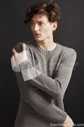 Image of Serious, fashion and man in sweater thinking in studio isolated on a a grey background. Model, idea and dream in style, trendy clothes and young, handsome or casual insecure person on a backdrop