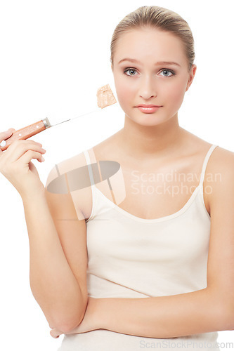 Image of Makeup, foundation and unhappy woman with portrait for beauty, skincare and cosmetics in studio. Sad, frustrated and female person with skin issue and problem from face product with white background