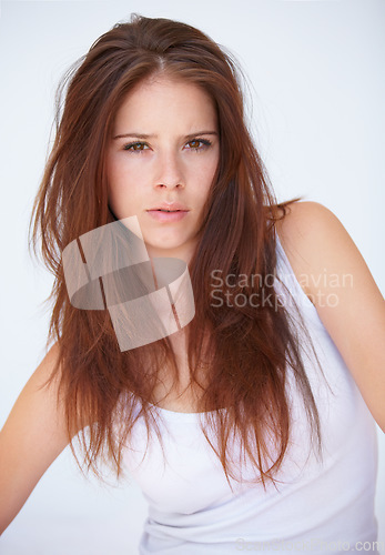 Image of Portrait, serious and woman in studio with attitude, confidence or mindset against a white background. Hair fail, face and female model with haircare mistake, damage or unexpected haircut or color