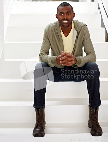 Image of Office, stairs and portrait of business black man for professional career, confidence and pride. Building, company and happy worker sitting on steps with ambition for work, job and opportunity