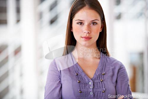 Image of Portrait, confident and a business woman arms crossed in her professional office for an internship. Mindset, serious and attitude with a young employee in her design agency workplace or company