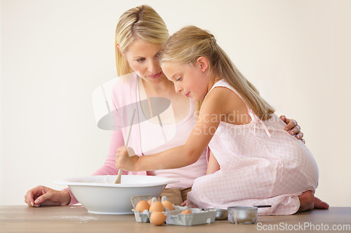 Image of Bowl, spoon and baking mom, child or family mix ingredients, food or prepare meal, flour or recipe. Home kitchen counter, teaching and kid learning youth development skills, cooking or how to bake