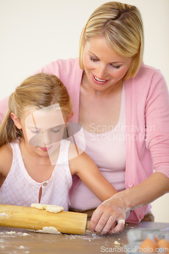 Image of Dough, rolling pin or baking family, child and mom teaching youth, daughter or girl to prepare dessert, food or recipe. Kitchen, support or young kid learning home cooking together with mother