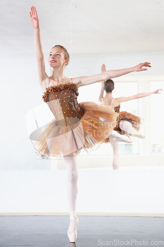 Image of Ballerina, dancing and ballet dancer studio with training, exercise and performance workout. Tutu, balance and pointe with a female athlete and happy with practice and confidence with pose and smile