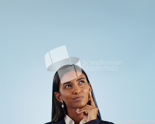 Image of Thinking space, solution or businesswoman in studio for problem solving on blue background. Ideas, doubt or decision with an Indian attorney or lawyer contemplating a thought, choice or legal option