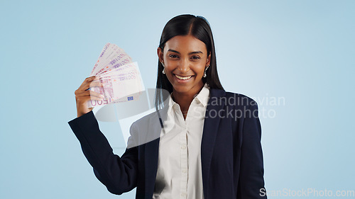 Image of Happy business woman, portrait and money fan in financial freedom against a blue studio background. Excited female person or employee with cash, savings or investment for bonus salary on mockup space