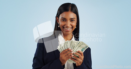 Image of Business woman, portrait and money in financial freedom against a blue studio background. Happy female person or employee with cash, savings or dollar bills for bonus salary or investment on mockup