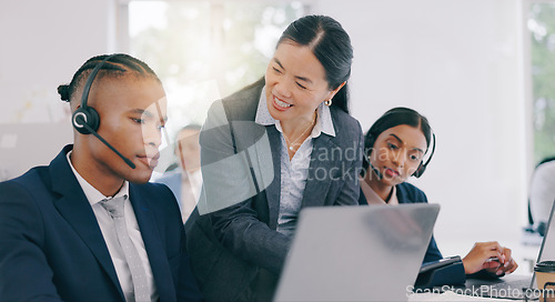 Image of Call center, customer support and manager with consultant in the office helping with online consultation. Contact us, telemarketing and mature female person talking to black man agent in workplace.