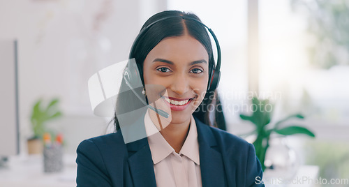 Image of Happy woman, portrait and headphones in call center for customer service or support at office. Face of friendly Indian female person, consultant or agent smile for online advice or help at workplace
