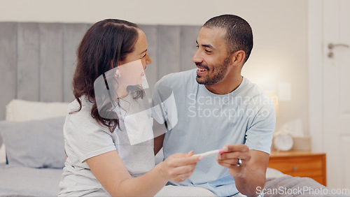 Image of Excited couple, bed and positive pregnancy test for family, start or maternity at home. Face of happy man and pregnant woman smile for parenthood, morning or good news or results in bedroom together