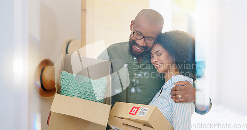 Image of Real estate, box and hug with a black couple moving house for growth, investment or mortgage. Property, love or smile with a happy man and woman in their new home or apartment together for romance