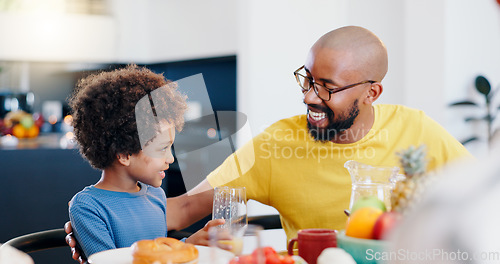 Image of Black family, food and father with child for breakfast, lunch and eating together in home. Happy, talking and dad and boy at table for bonding with meal for health, nutrition and hunger in house