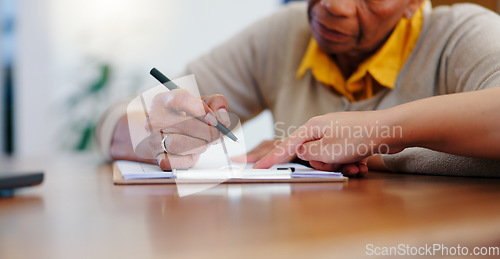 Image of Senior woman, hands and writing on contract, form or application for retirement plan or insurance at home. Closeup of elderly female person signing documents, paperwork or agreement on table at house