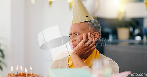 Image of Thinking, birthday and sad senior woman with depression, grief and lonely in her home. Cake, face and elderly African person alone at a party with disappointment, frustrated or annoyed in a house