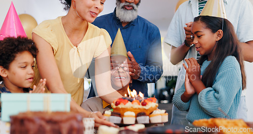 Image of Cake, surprise and family at birthday party celebration together at modern house with candles and cake. Smile, excited and young children with African father and grandparents for dessert at home.