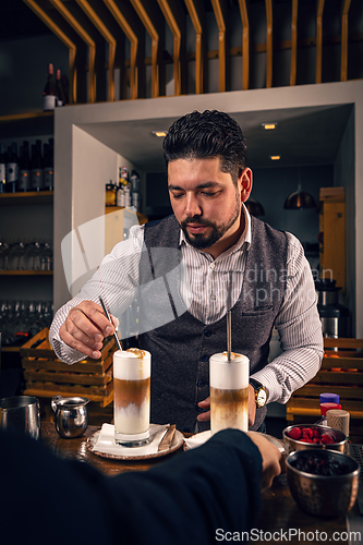 Image of Glasses of latte macchiato coffee